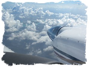 Above the clouds, heading South.